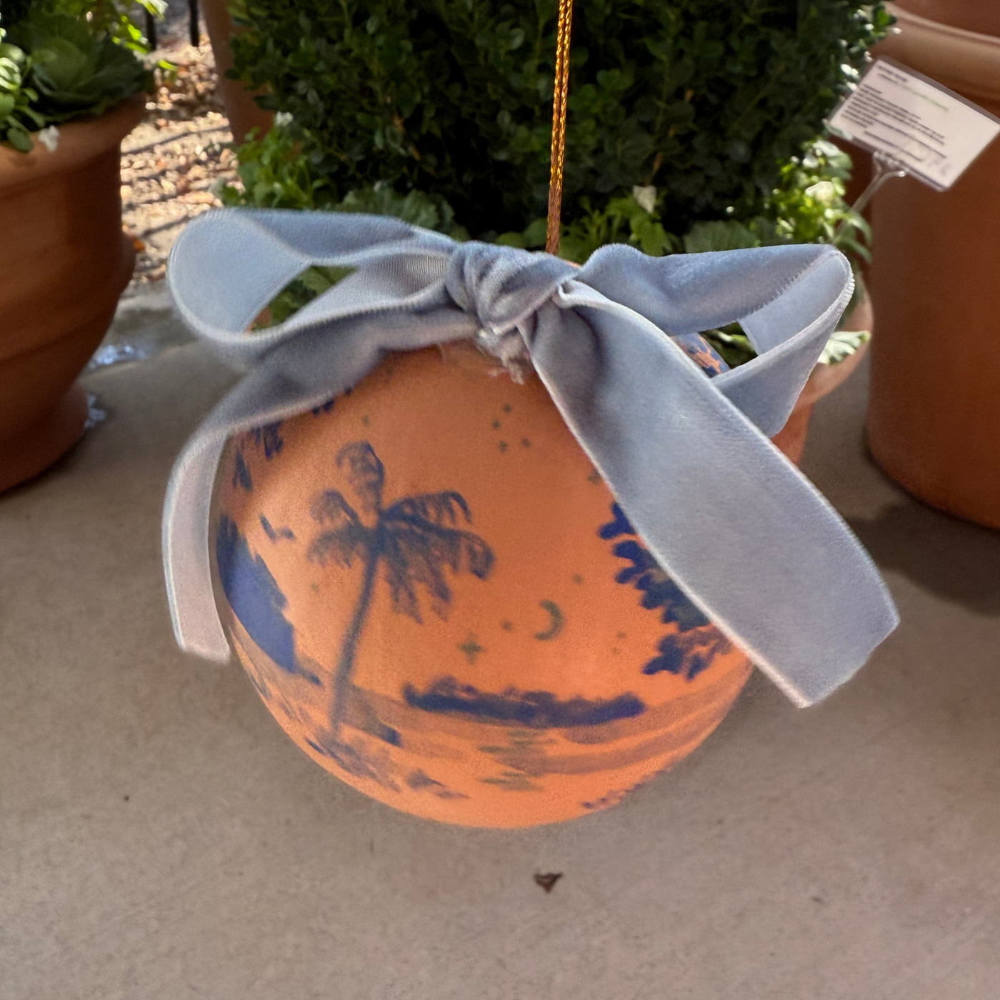 Hand-painted Ornament by Sarah Schools - Dark Blue on Coral