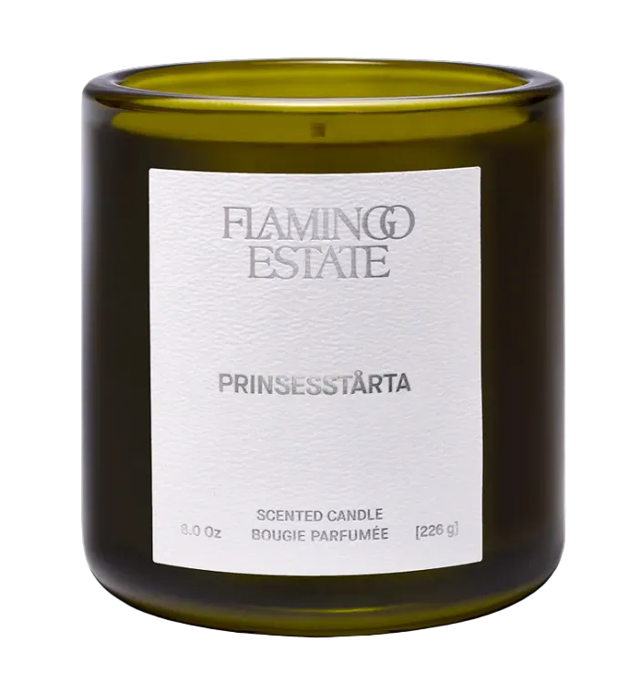 Scented candle with 'Flamingo Estate' label on a white background
