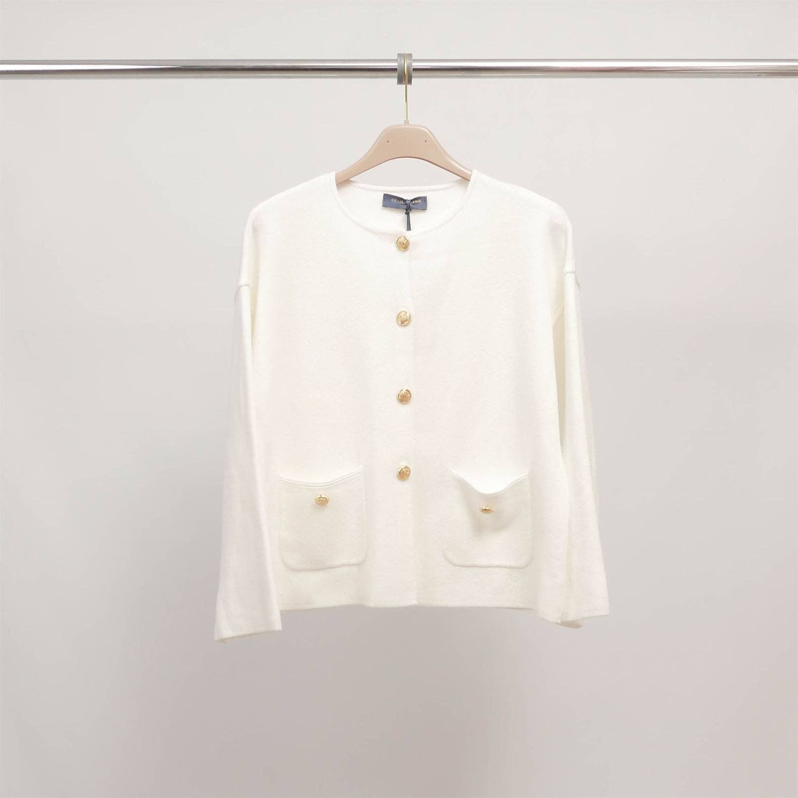 White buttoned cardigan with patch pockets