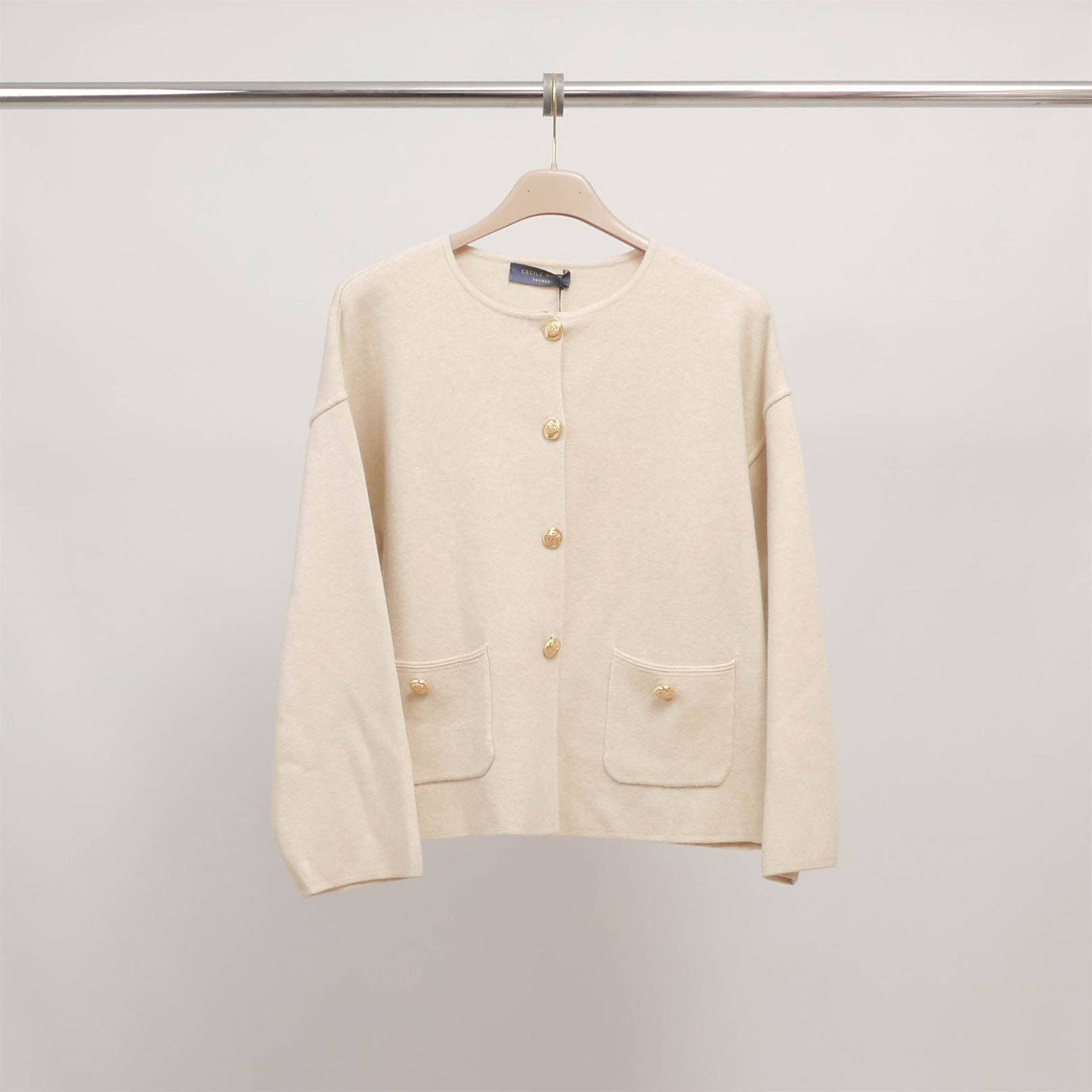 Ivory buttoned cardigan with patch pockets