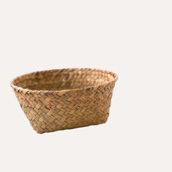 Woven basket on a white marble surface