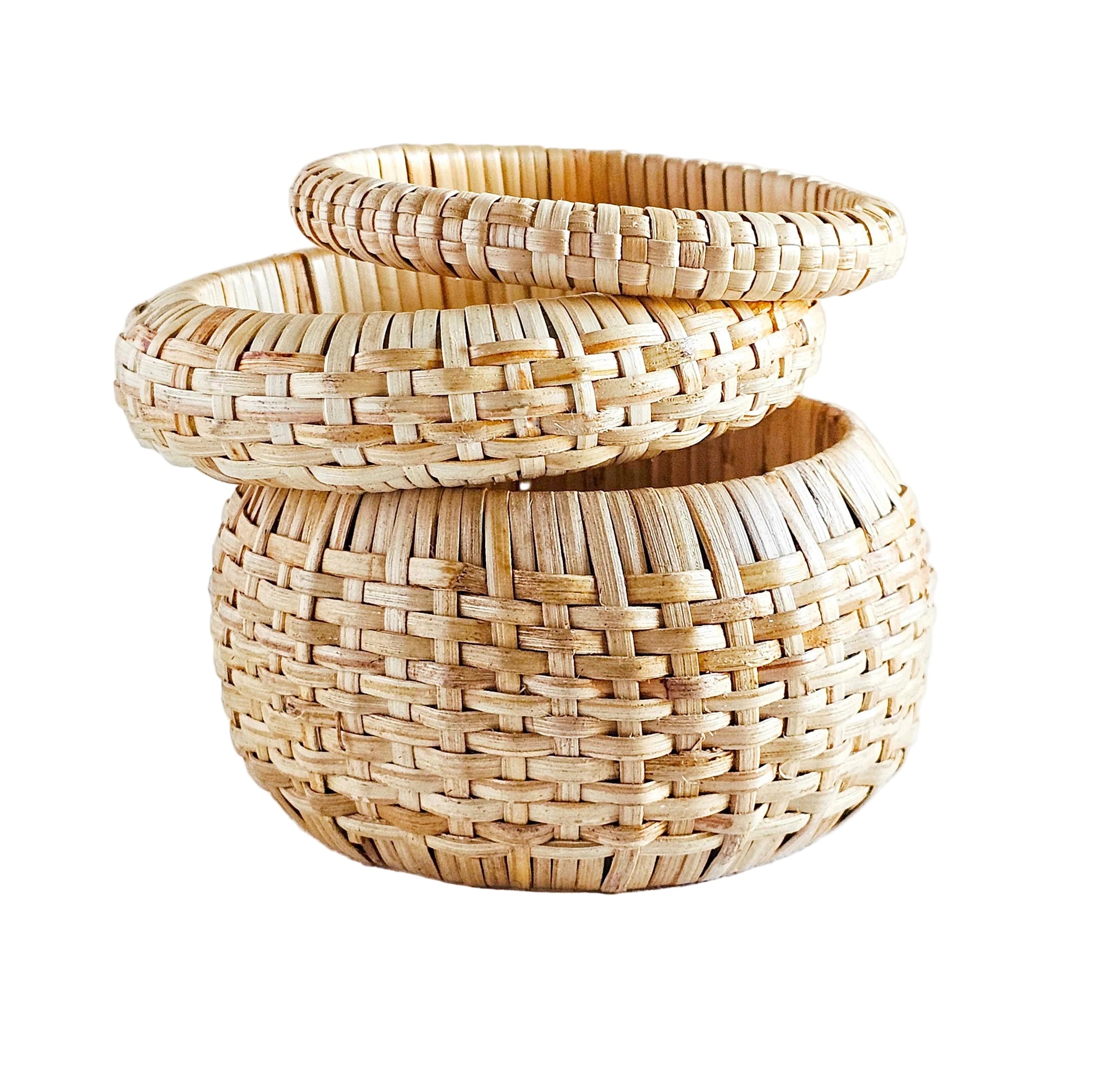 Stack of woven baskets on a white background