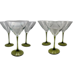 Four clear stemmed martini glasses with olive-green bases, shown in a split two-by-two arrangement on a light gray background.